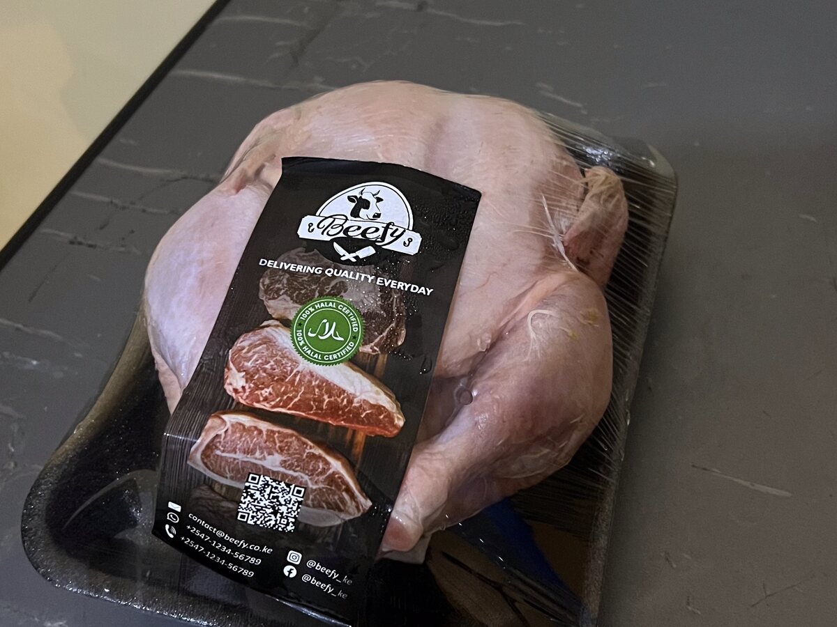 Whole halal chickens in trays at Beefy